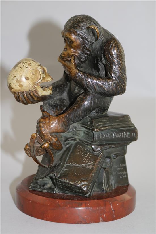 Wolfgang Hugo Rheinhold (1853-1900). A patinated and cold painted bronze sculpture ape with skull, 7.5in.